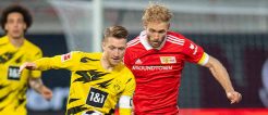 Dortmunds Kapitän Reus im Kampf um den Ball gegen Unions Griesbeck